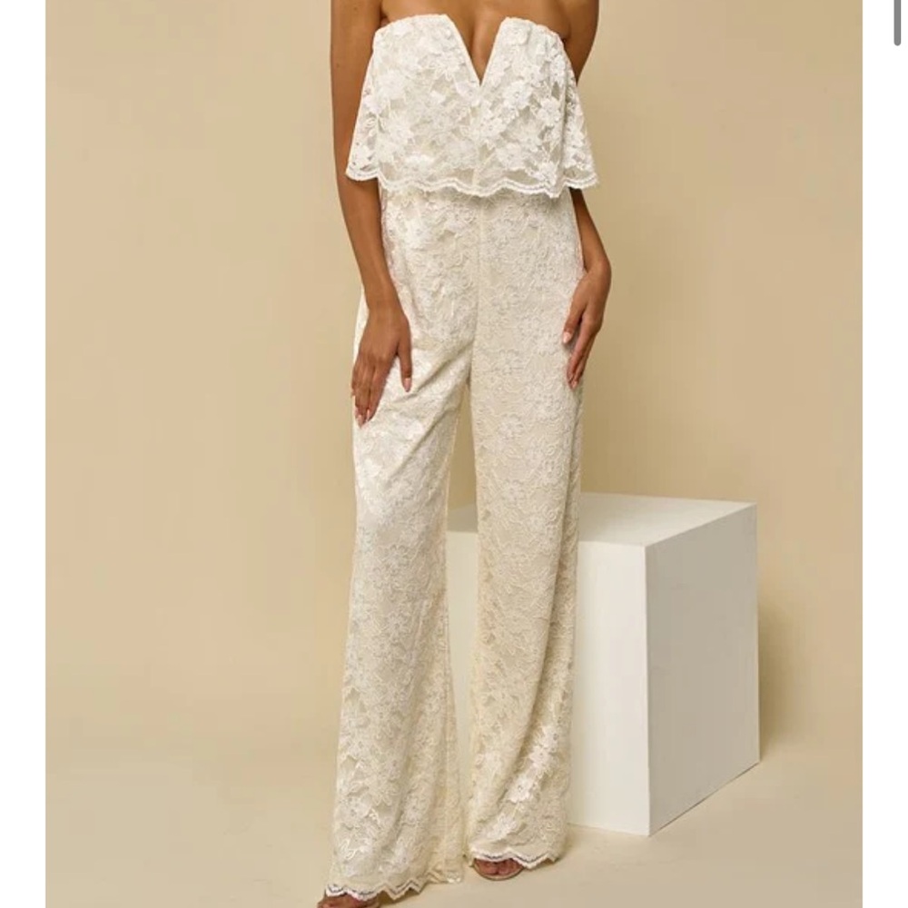 NWT Ivory Lace Strapless Jumpsuit with Ruffle Detail. Size Medium